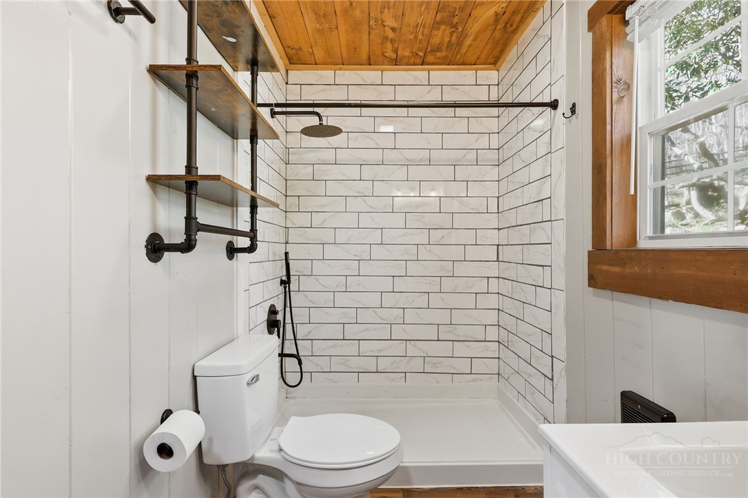 286 Grady Winkler Road Boone, NC 28607 - Photo 6 of 13 a bathroom with a toilet and shower