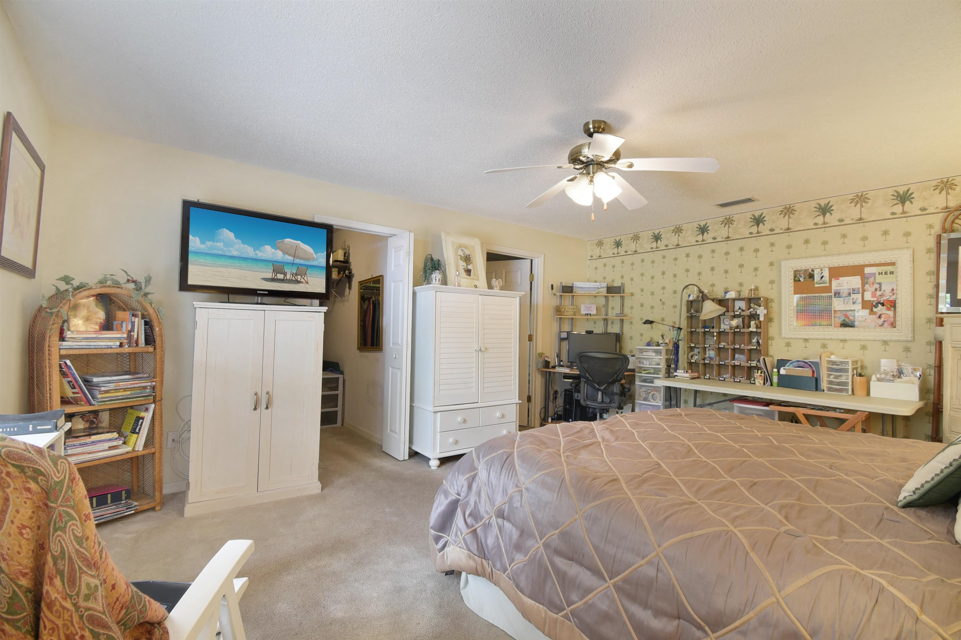 1711 Old Beach Road St. Augustine, FL 32080 - Photo 13 of 34 a bed room with a bed and a chandelier