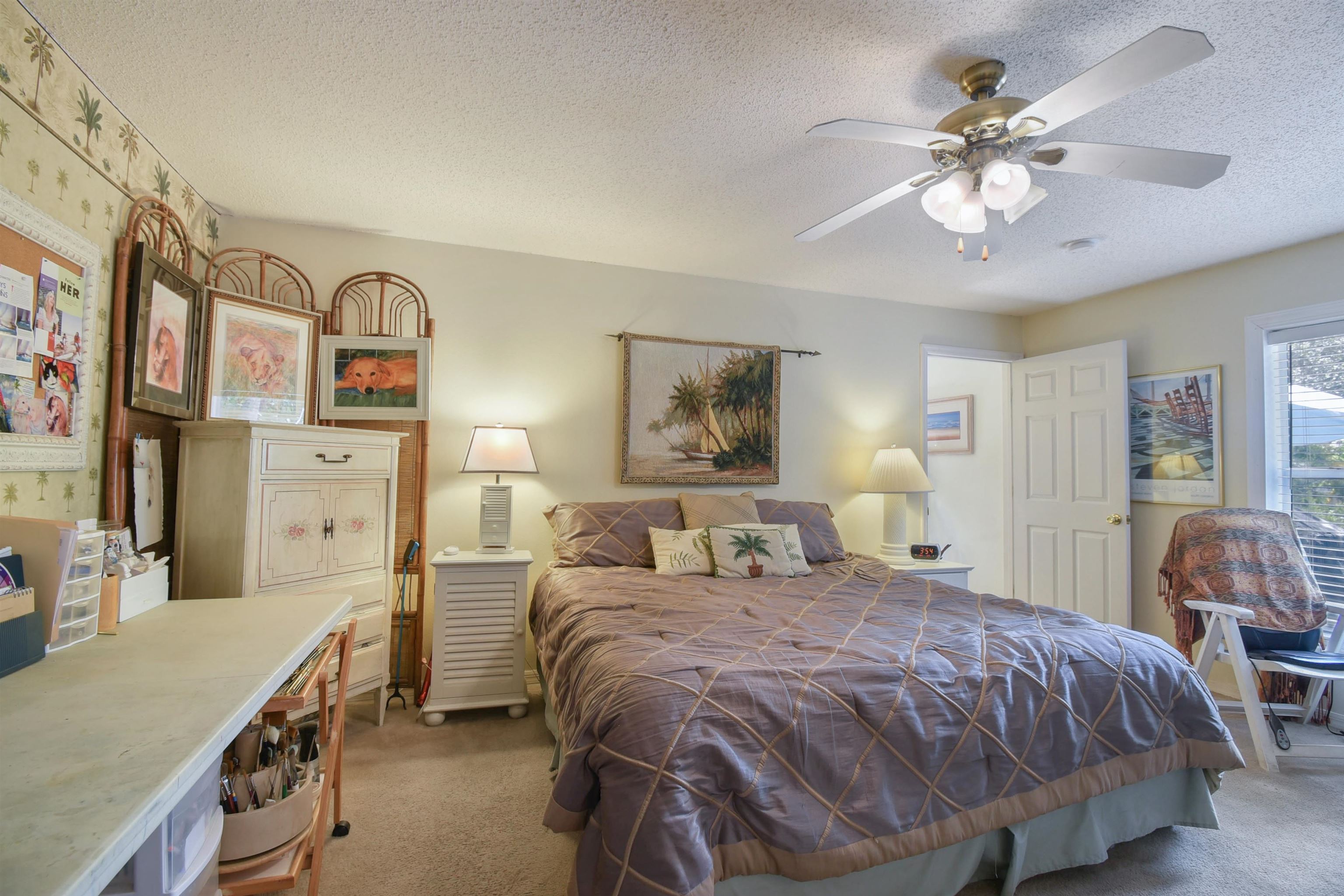 1711 Old Beach Road St. Augustine, FL 32080 - Photo 14 of 34 a bed room with a bed and a chandelier