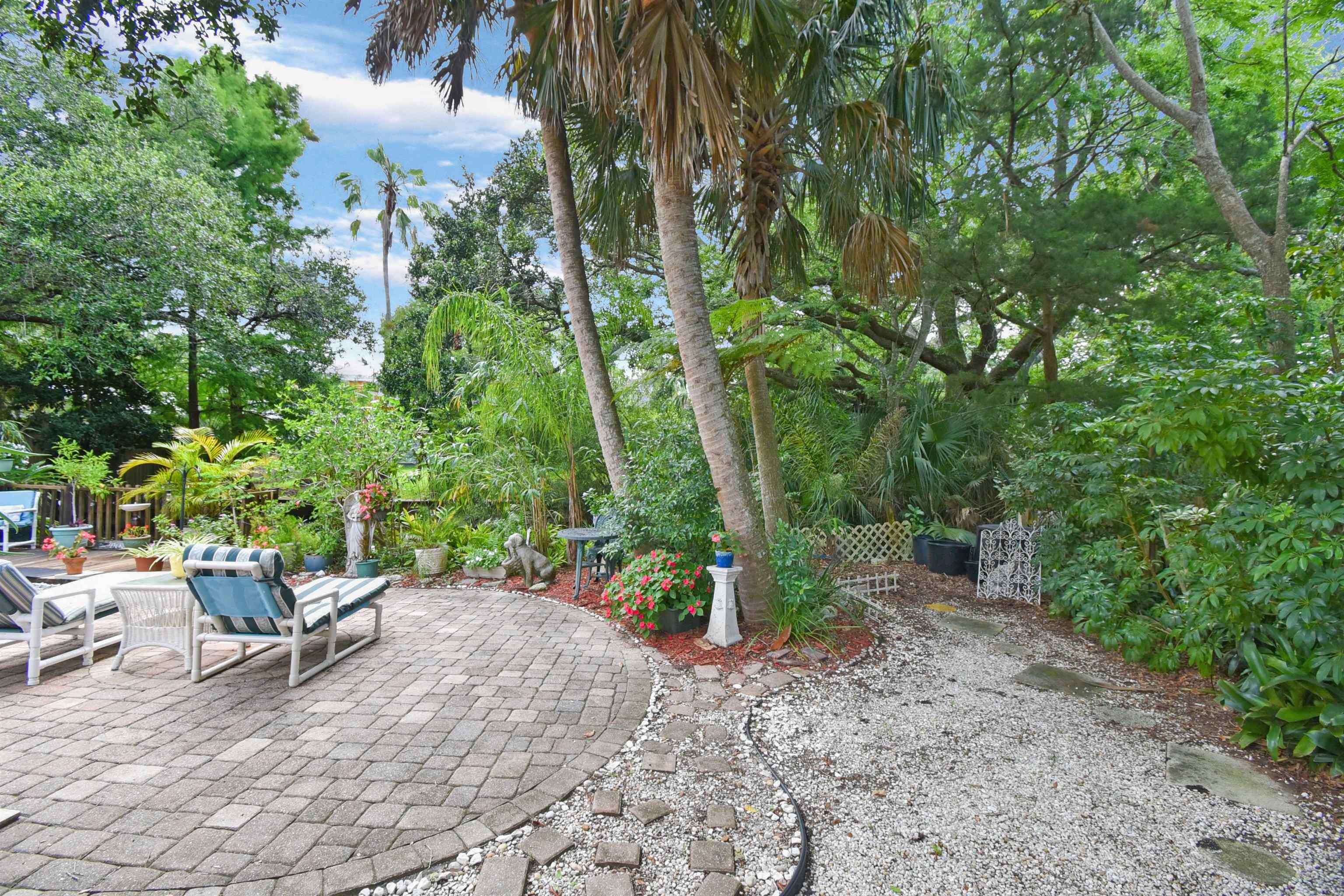 1711 Old Beach Road St. Augustine, FL 32080 - Photo 25 of 34 a view of a backyard with sitting area