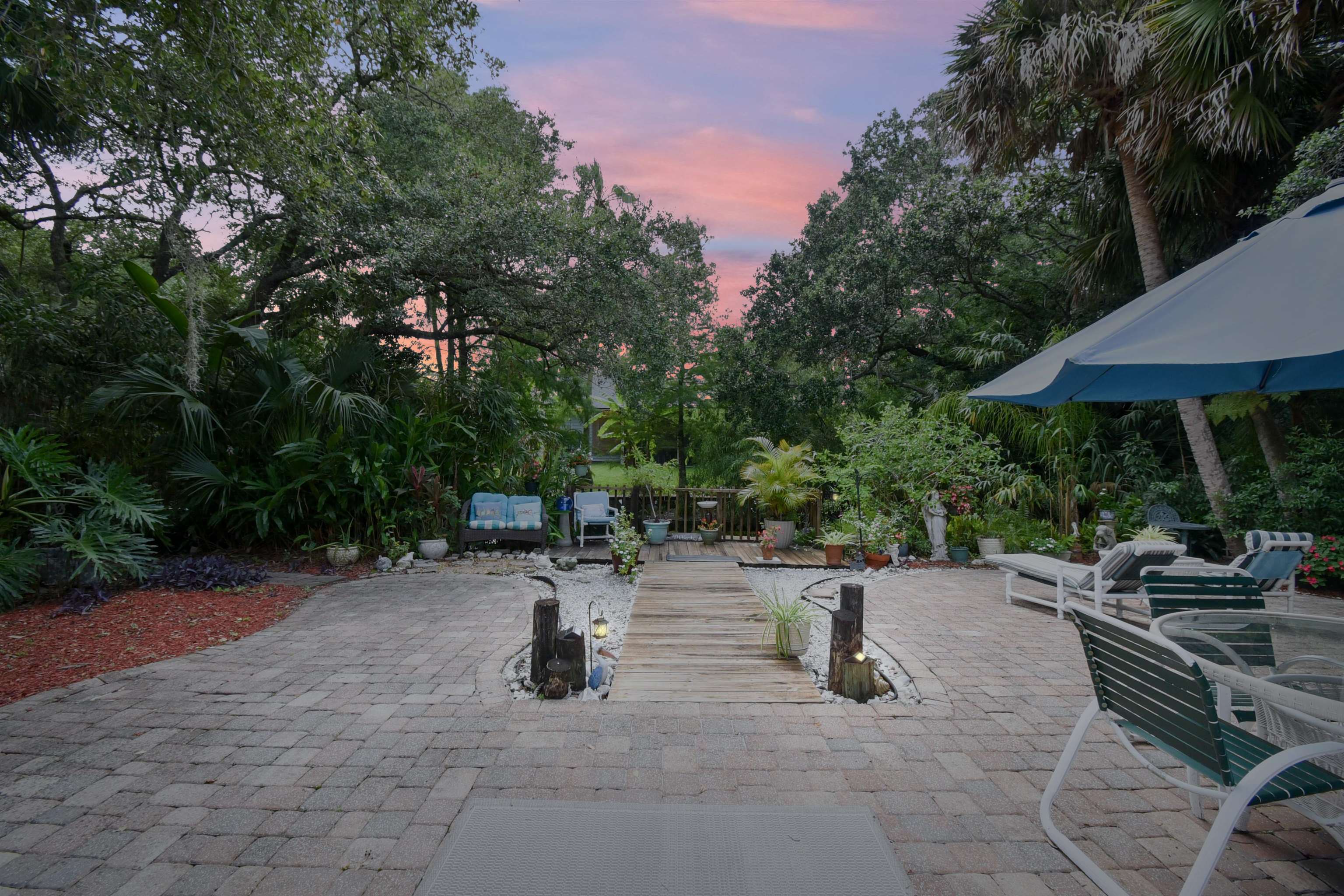 1711 Old Beach Road St. Augustine, FL 32080 - Photo 28 of 34 an outdoor space with patio and white umbrellas