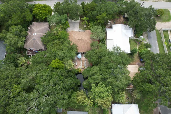 an aerial view of a house with yard