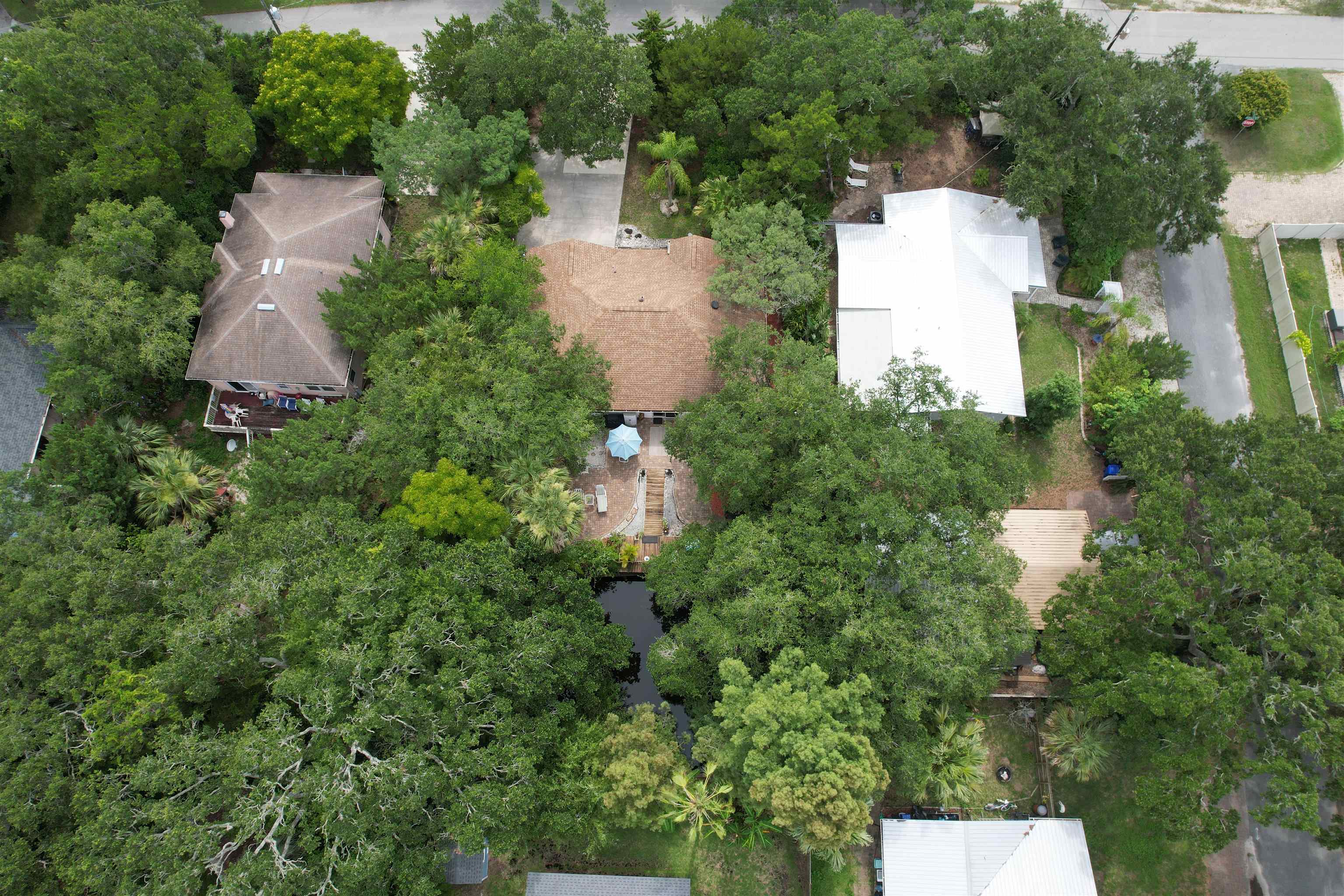 1711 Old Beach Road St. Augustine, FL 32080 - Photo 31 of 34 an aerial view of residential house with outdoor space and trees all around