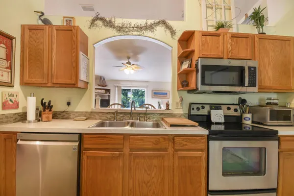 a living room with furniture a couch and a painting on the wall