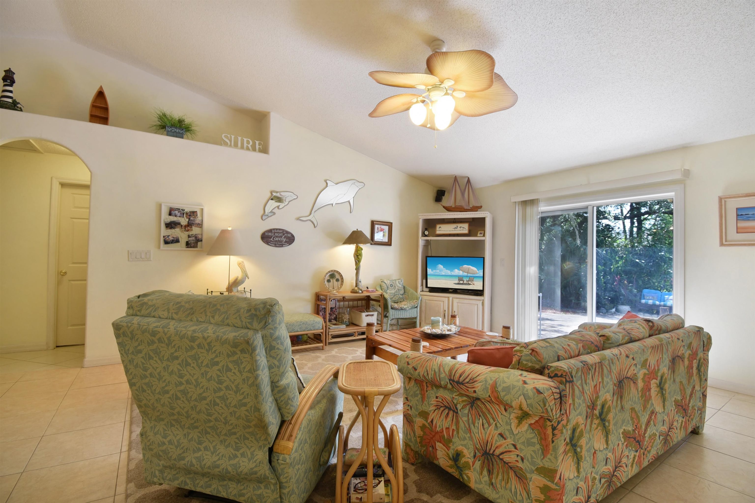 1711 Old Beach Road St. Augustine, FL 32080 - Photo 10 of 34 a living room with furniture and a large window