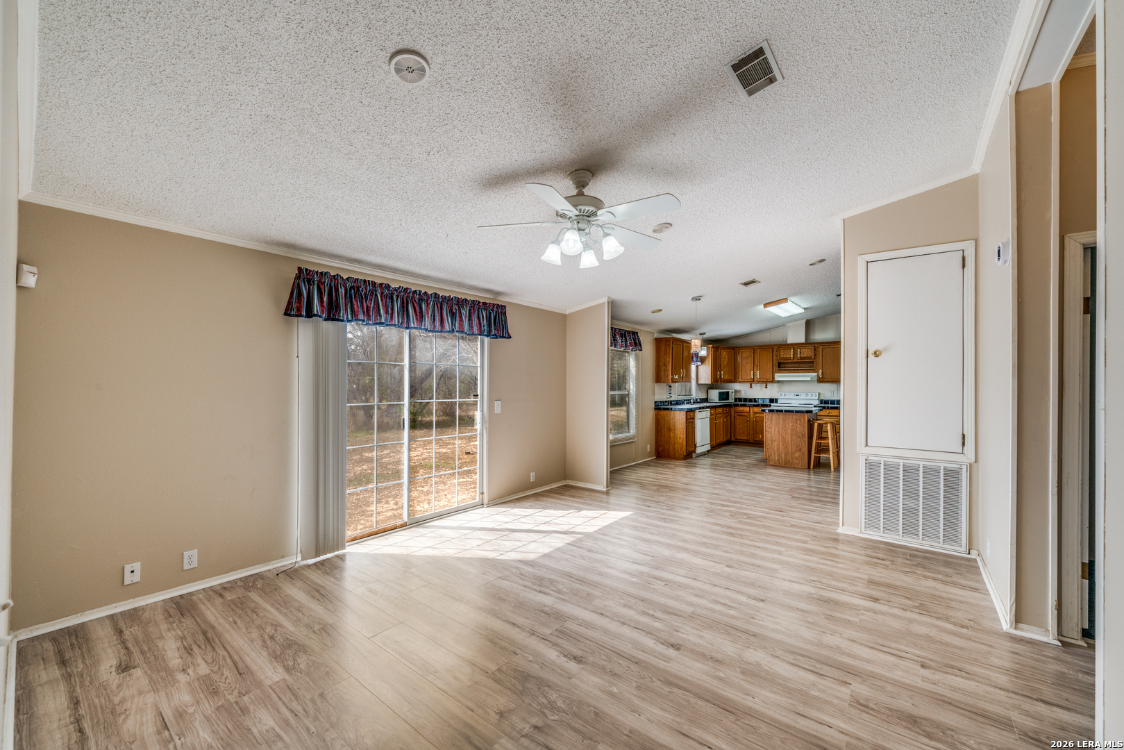 14975 Flatten Road San Antonio, TX 78223 - Photo 13 of 28 a view of a livingroom with a furniture and a ceiling fan