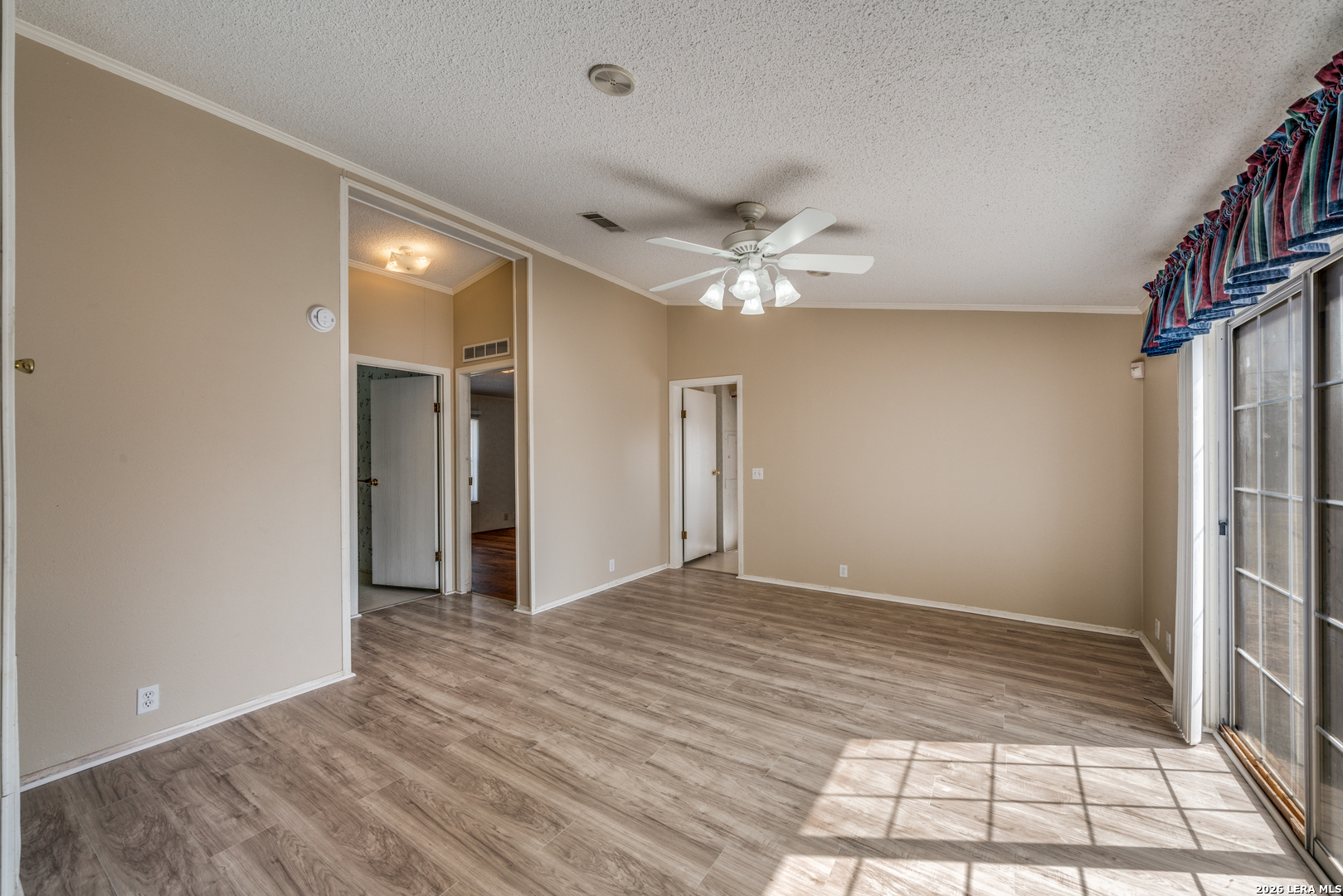 14975 Flatten Road San Antonio, TX 78223 - Photo 14 of 28 a view of entryway with wooden floor