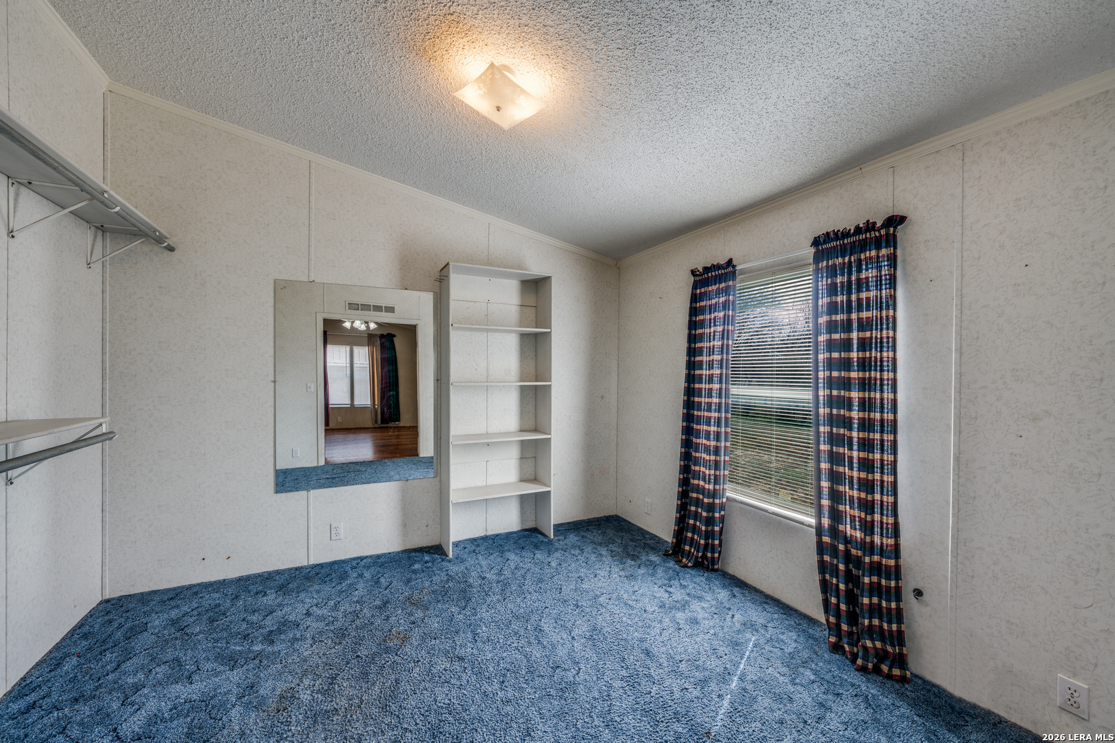 14975 Flatten Road San Antonio, TX 78223 - Photo 17 of 28 an empty room with windows