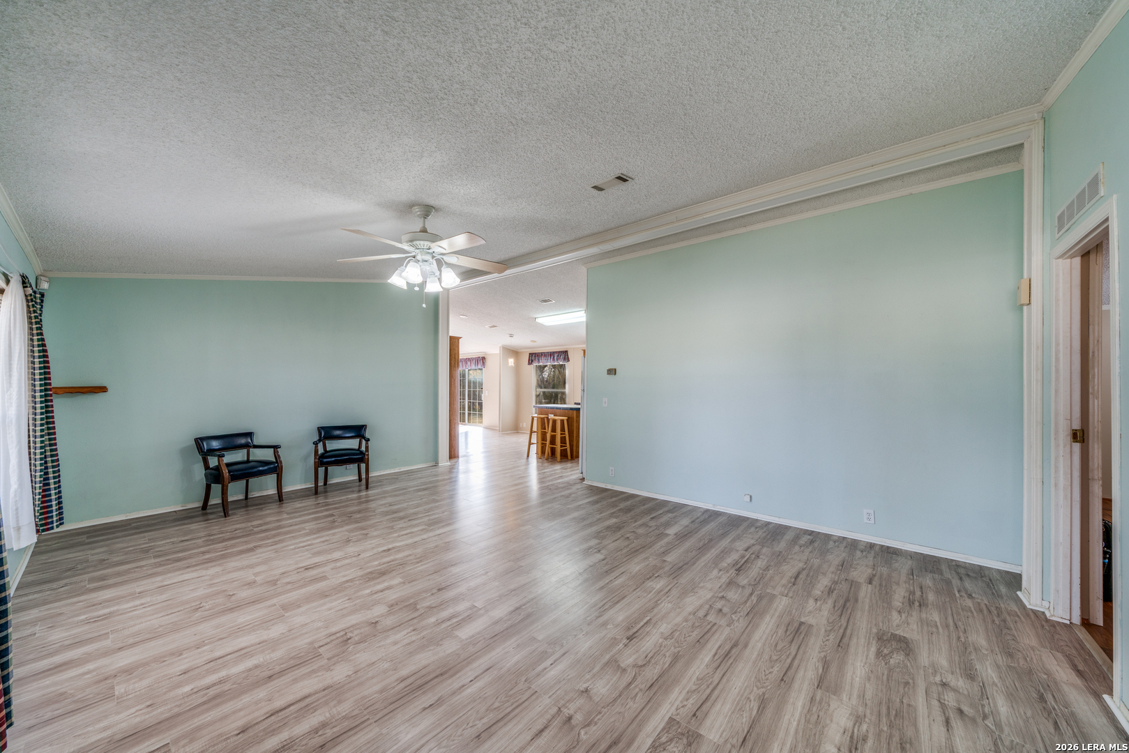 14975 Flatten Road San Antonio, TX 78223 - Photo 5 of 28 a view of a livingroom with furniture wooden floor and a window