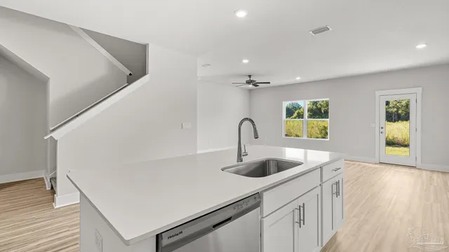 a view of kitchen with wooden floor and window