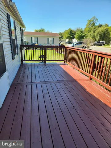 a view of balcony with wooden floor