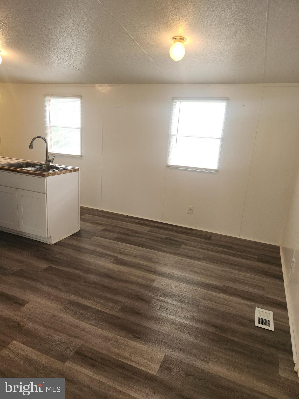 701 Cassel Road Manchester, PA 17345 - Photo 6 of 12 a view of a room with wooden floor and window