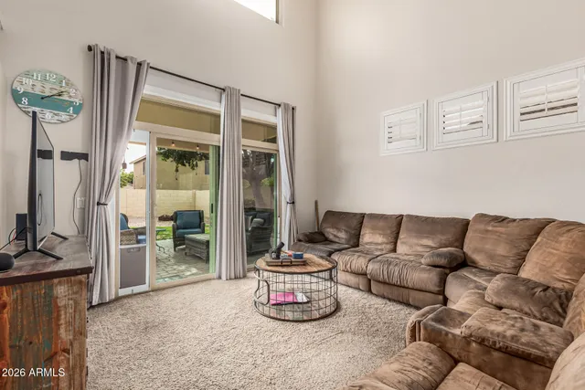 a kitchen with stainless steel appliances kitchen island granite countertop a stove refrigerator and cabinets