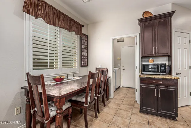 a view of a room with wooden floor and windows