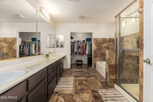 a bedroom with a bed and a desk in it