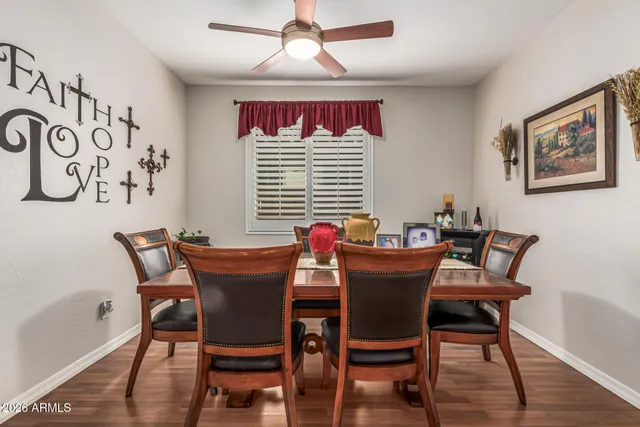 a dining room with furniture and window