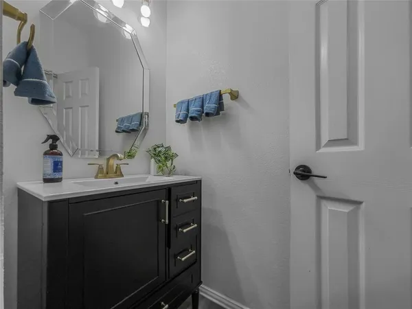 a bathroom with a sink and mirror