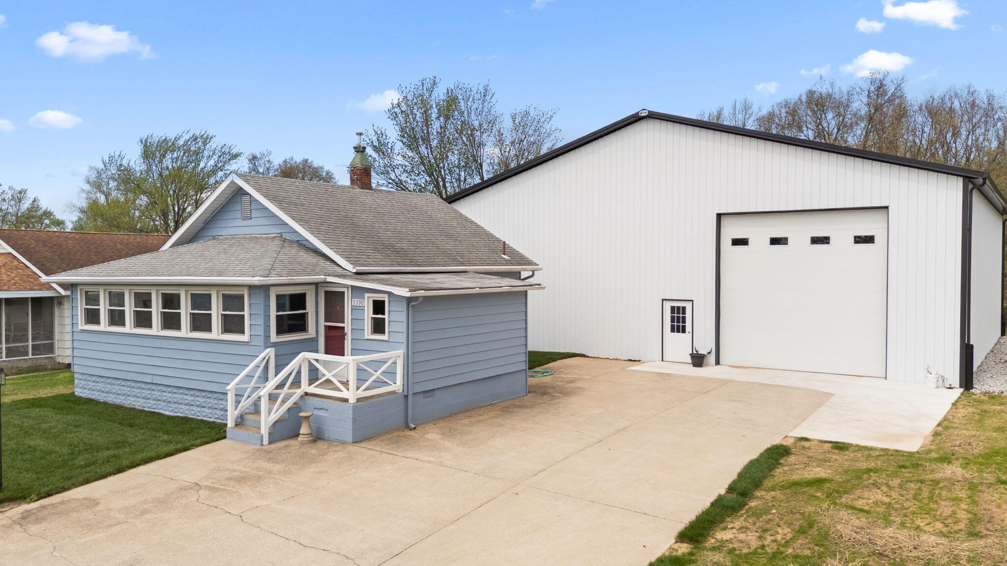 5590 East Maple Street Knox, IN 46534 - Photo 2 of 32 a front view of a house with garden
