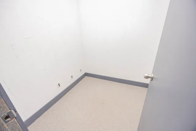 a bathroom with a sink toilet and a mirror