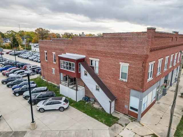 a view of a brick building with many windows