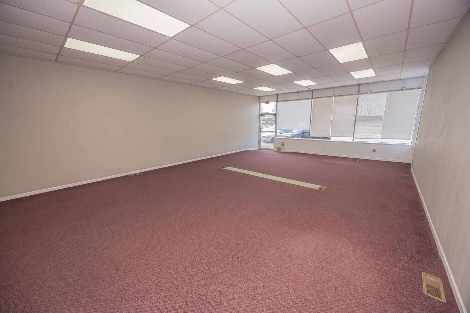 104 South Franklin Street Dwight, IL 60420 - Photo 9 of 20 an empty room with windows and chandelier fan