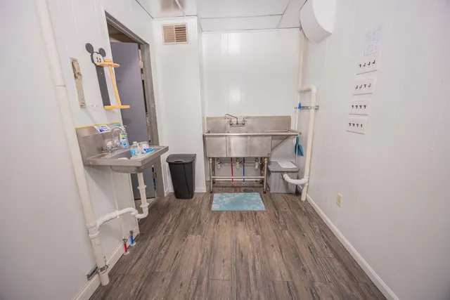 a view of a kitchen from the hallway