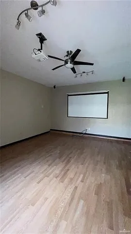 a view of room with a ceiling fan