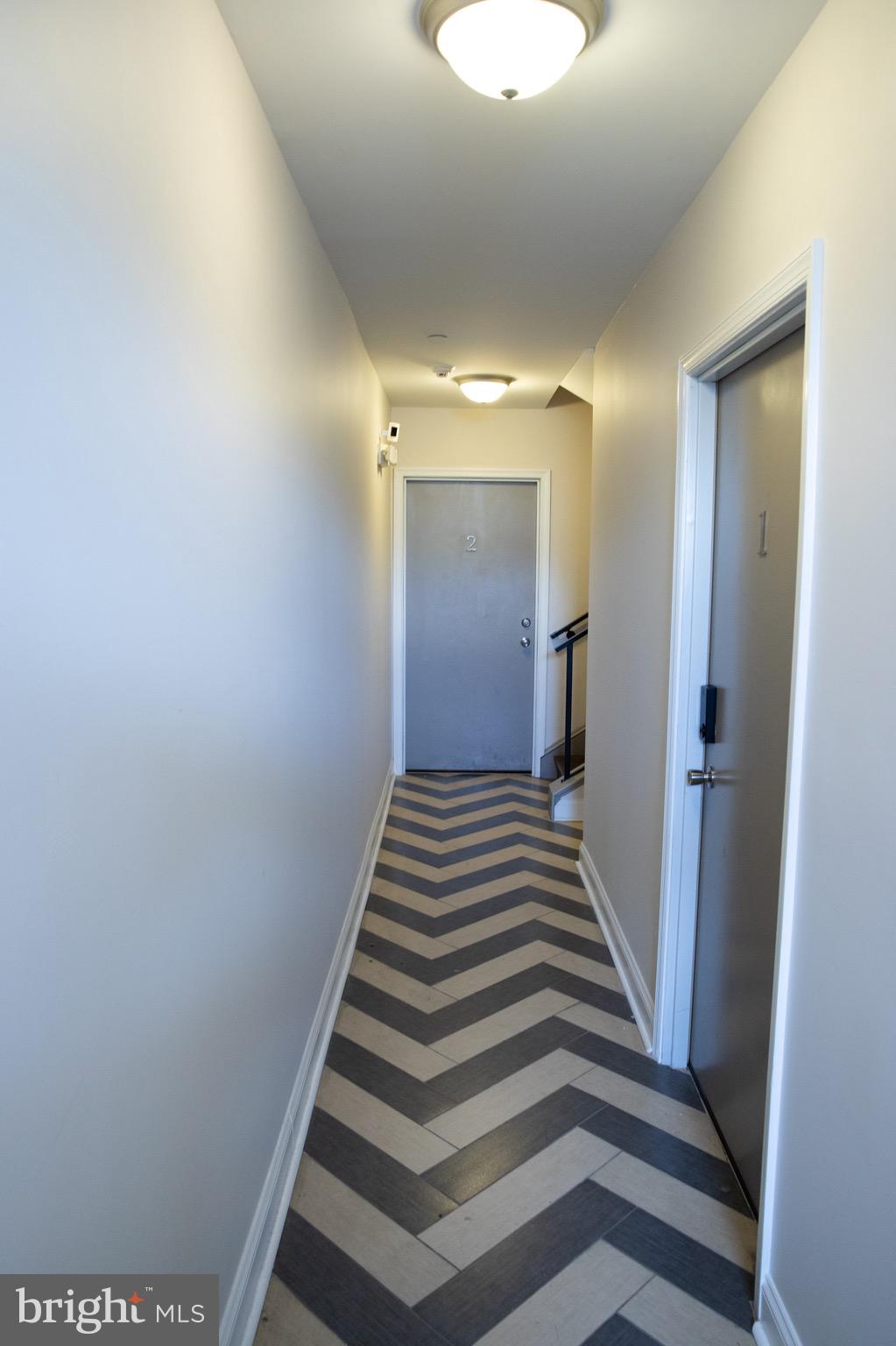 323 East Allen Street, Unit 4 Philadelphia, PA 19125 - Photo 23 of 24 a view of a hallway with entryway and wooden floor