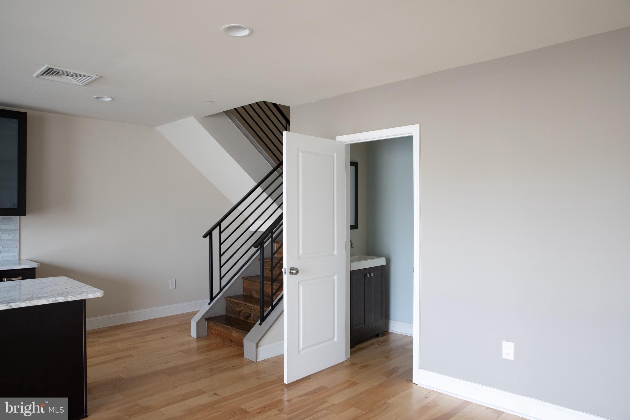323 East Allen Street, Unit 4 Philadelphia, PA 19125 - Photo 4 of 24 a view of hallway with stairs and wooden floor