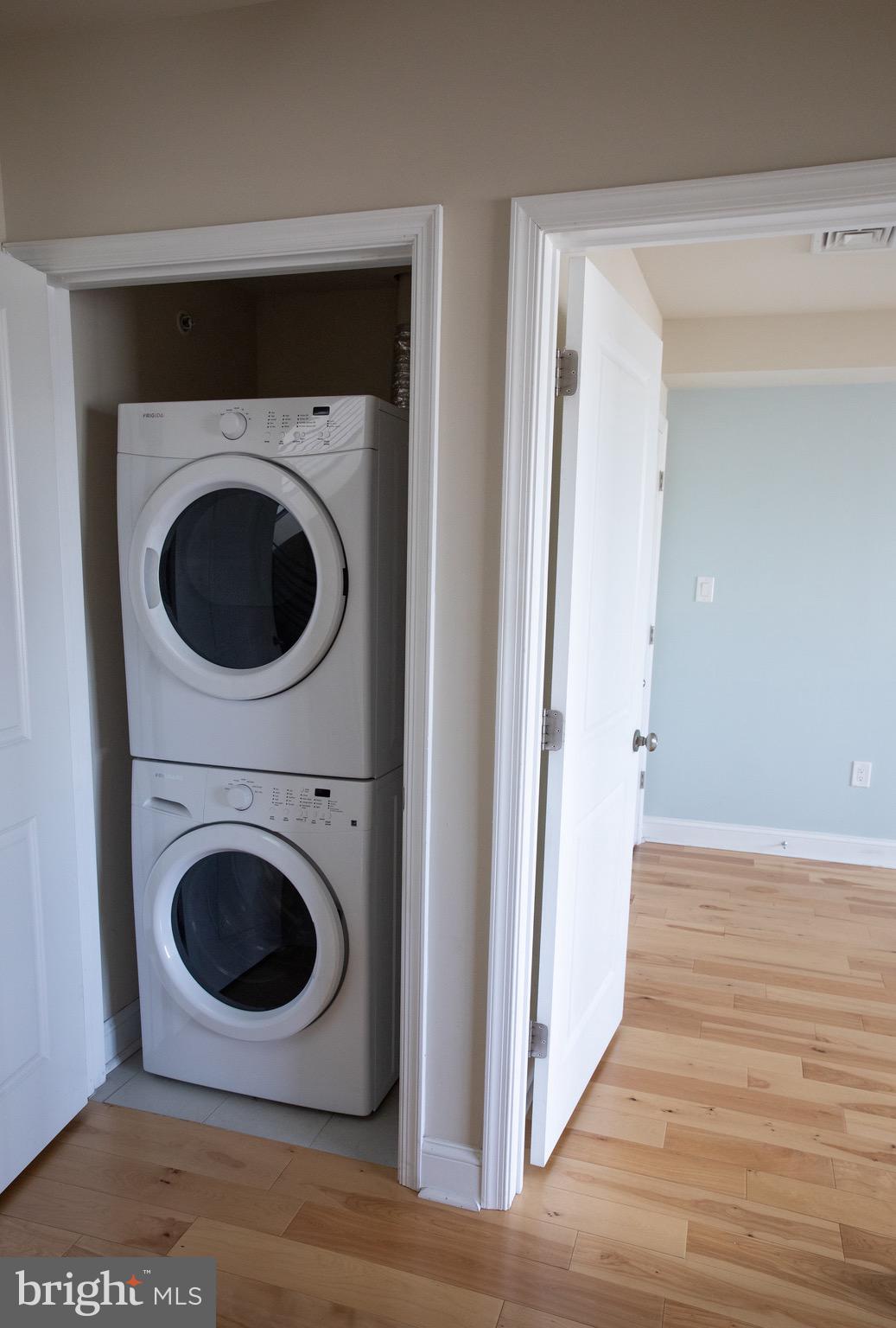 323 East Allen Street, Unit 4 Philadelphia, PA 19125 - Photo 8 of 24 a view of a hallway with washer and dryer
