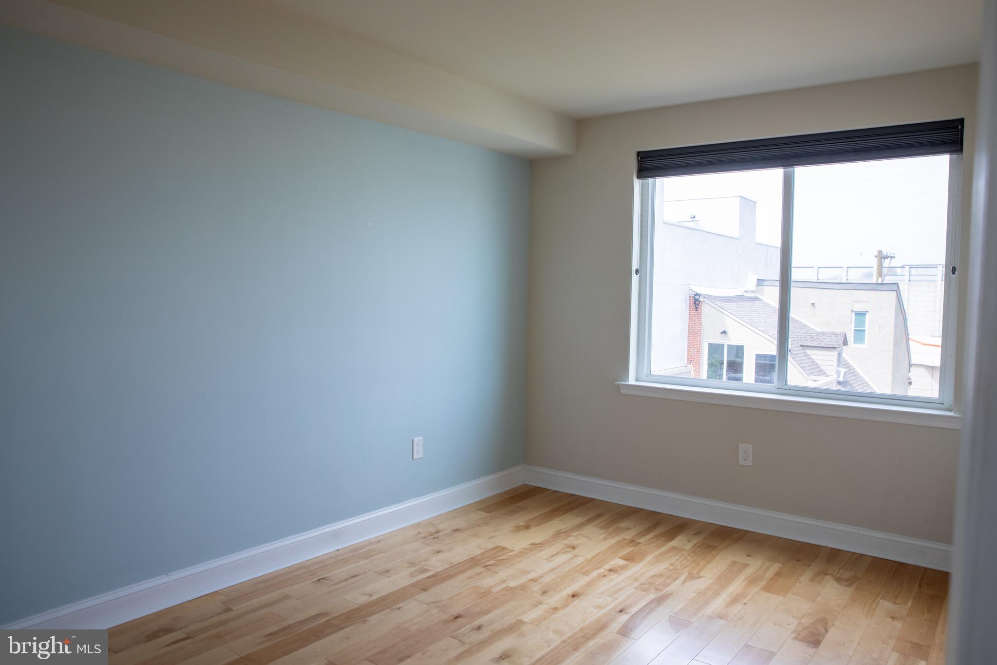 323 East Allen Street, Unit 4 Philadelphia, PA 19125 - Photo 9 of 24 a view of empty room with wooden floor and fan
