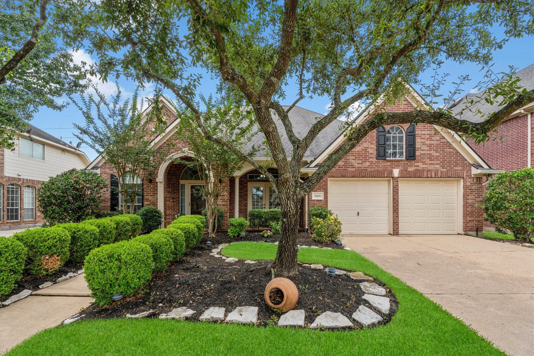 9406 Lochflora Drive Spring, TX 77379 - Photo 1 of 49 a front view of a house with garden