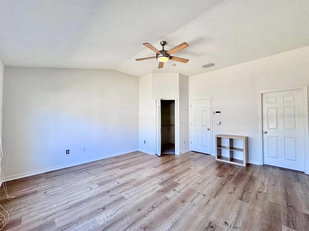 10035 Tranquility Way Tampa, FL 33625 - Photo 20 of 28 wooden floor in an empty room with a window