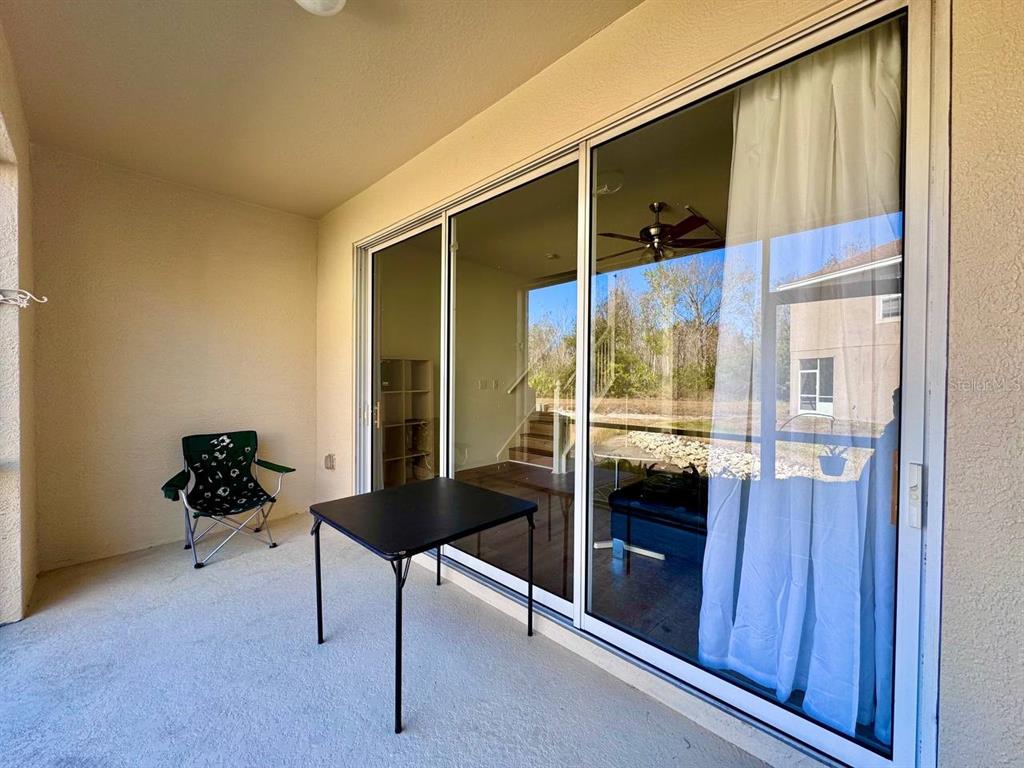 10035 Tranquility Way Tampa, FL 33625 - Photo 24 of 28 a room with window and furniture