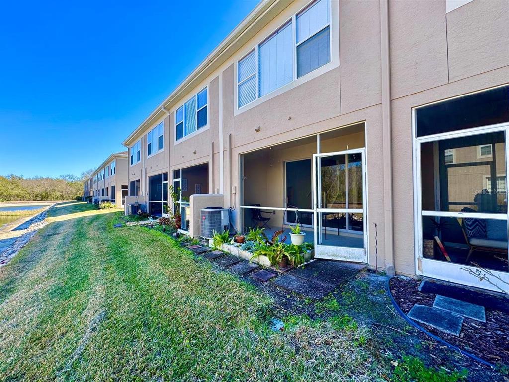 10035 Tranquility Way Tampa, FL 33625 - Photo 26 of 28 a view of house with yard and entertaining space