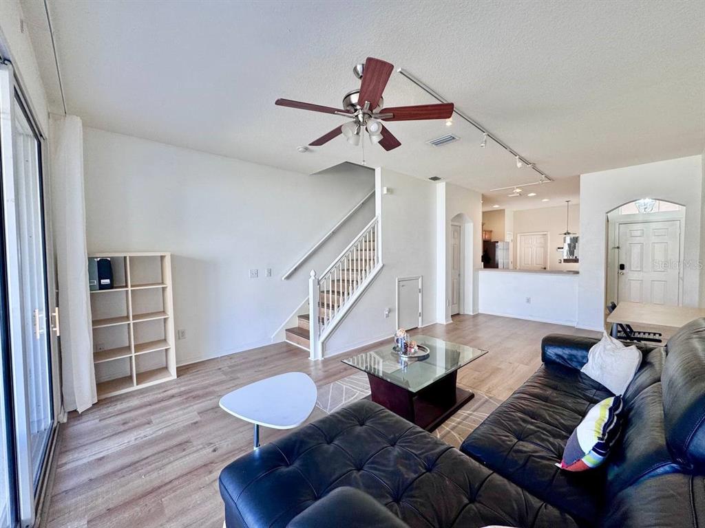 10035 Tranquility Way Tampa, FL 33625 - Photo 5 of 28 a living room with furniture and wooden floor