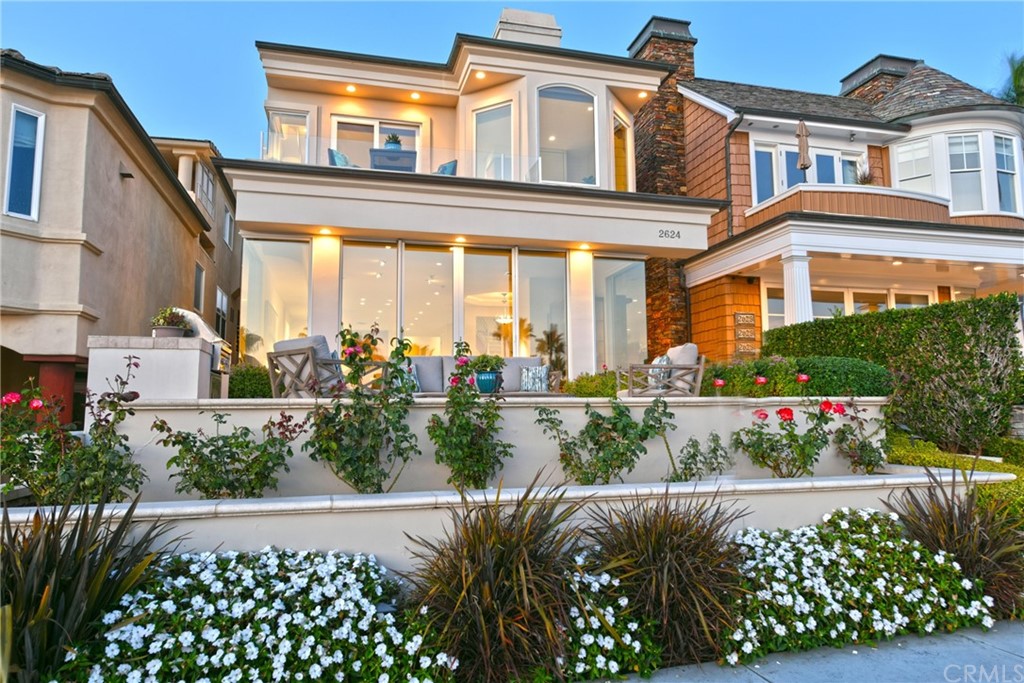 2624 Ocean Boulevard Corona del Mar, CA 92625 - Photo 3 of 10 front view of a house with a lot of flower plants