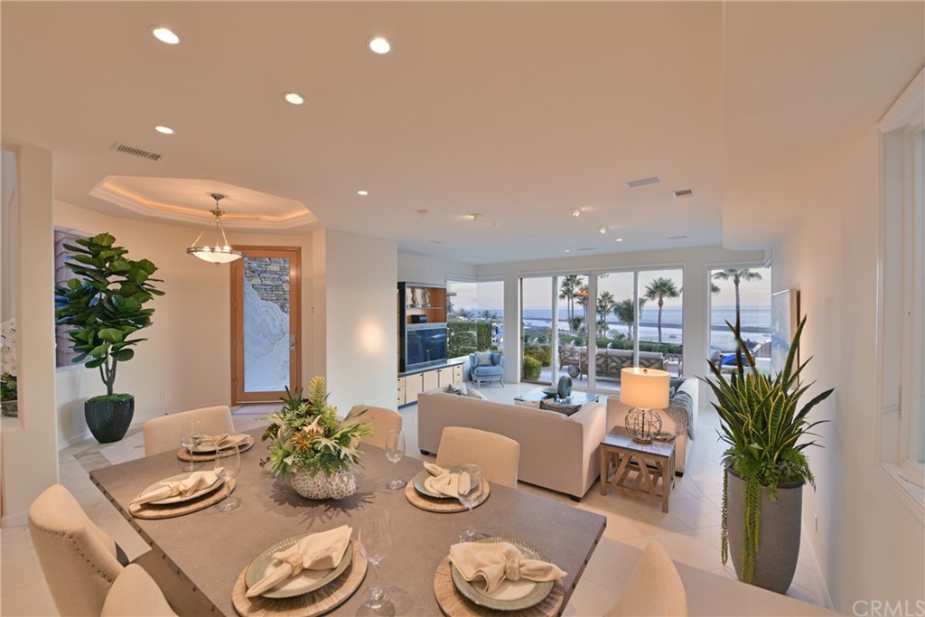 2624 Ocean Boulevard Corona del Mar, CA 92625 - Photo 5 of 10 a dining room with furniture and potted plants