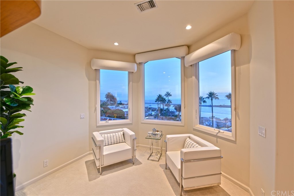 2624 Ocean Boulevard Corona del Mar, CA 92625 - Photo 7 of 10 a living room with furniture and a potted plant