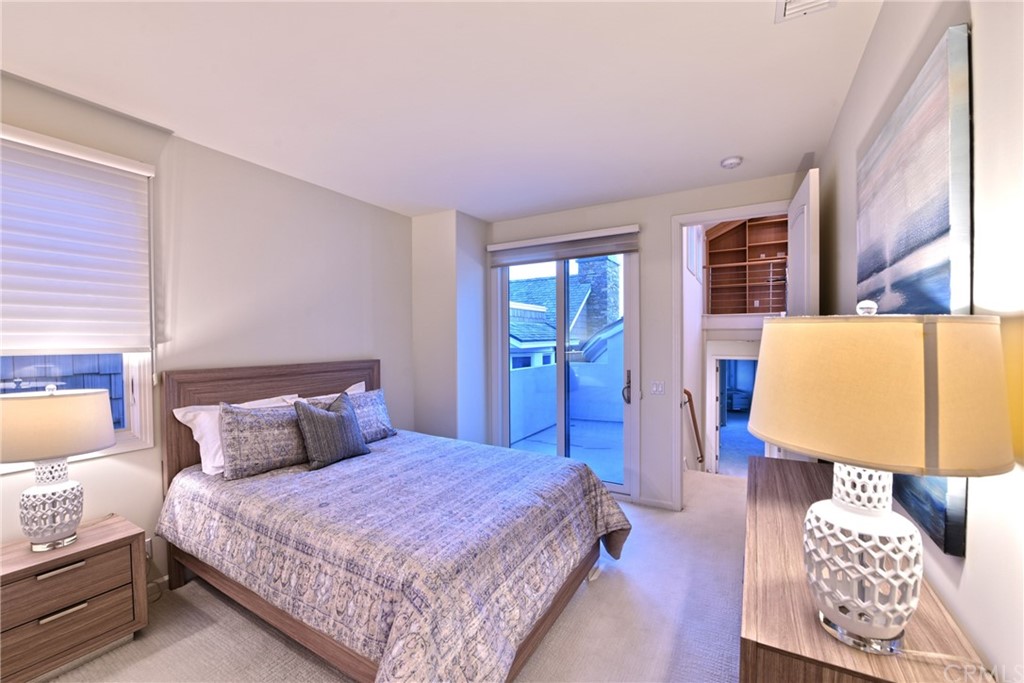 2624 Ocean Boulevard Corona del Mar, CA 92625 - Photo 8 of 10 a bedroom with a bed a dresser with wooden floor