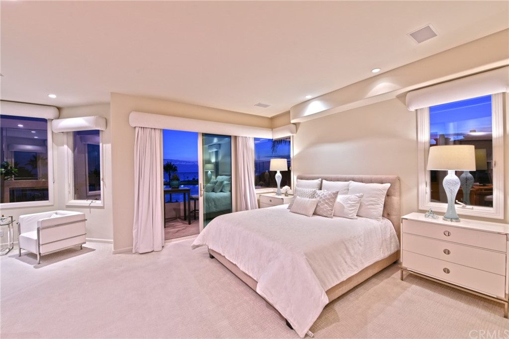 2624 Ocean Boulevard Corona del Mar, CA 92625 - Photo 9 of 10 a bedroom with a large bed and a view of living room