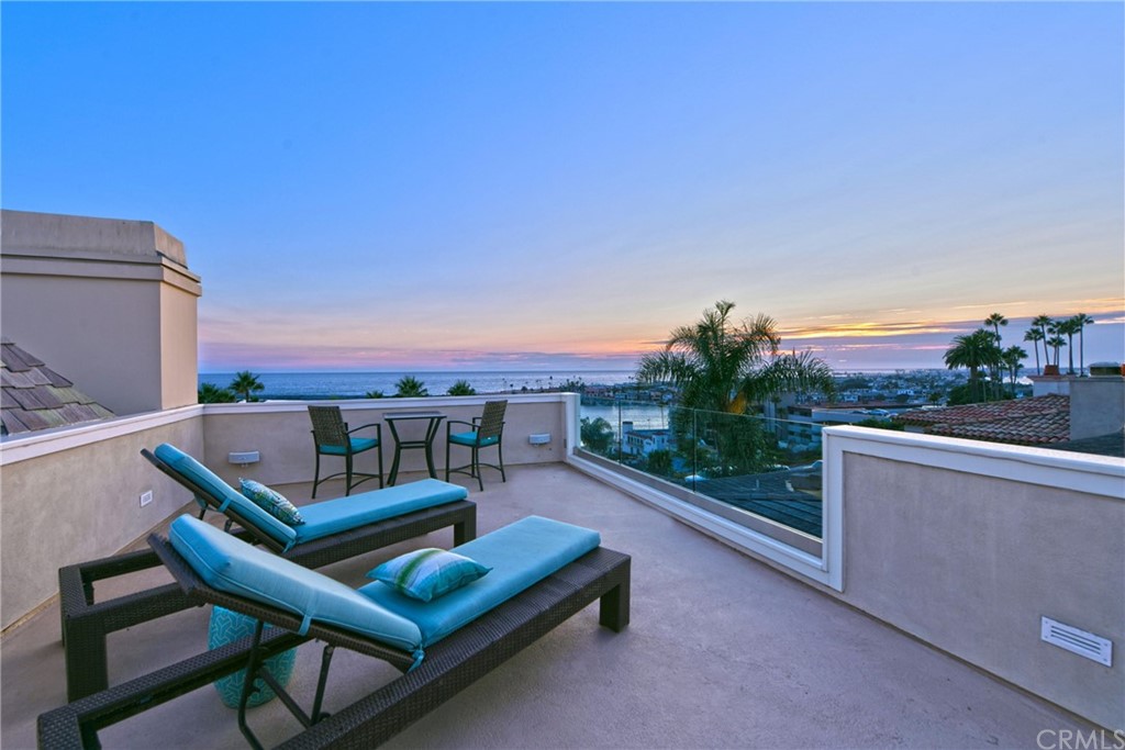 2624 Ocean Boulevard Corona del Mar, CA 92625 - Photo 10 of 10 a view of a roof deck with couches and wooden floor