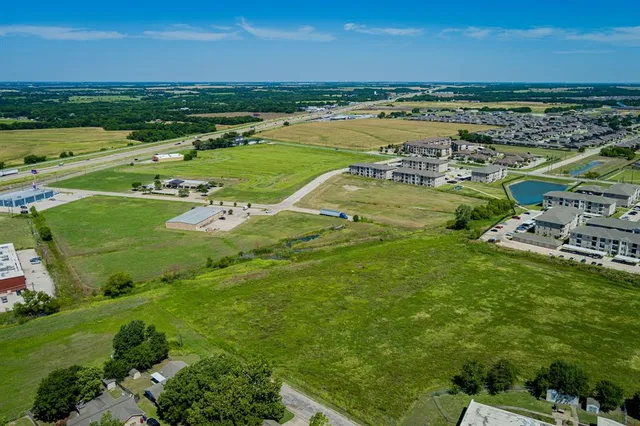 an aerial view of a residential houses with outdoor space and outdoor space