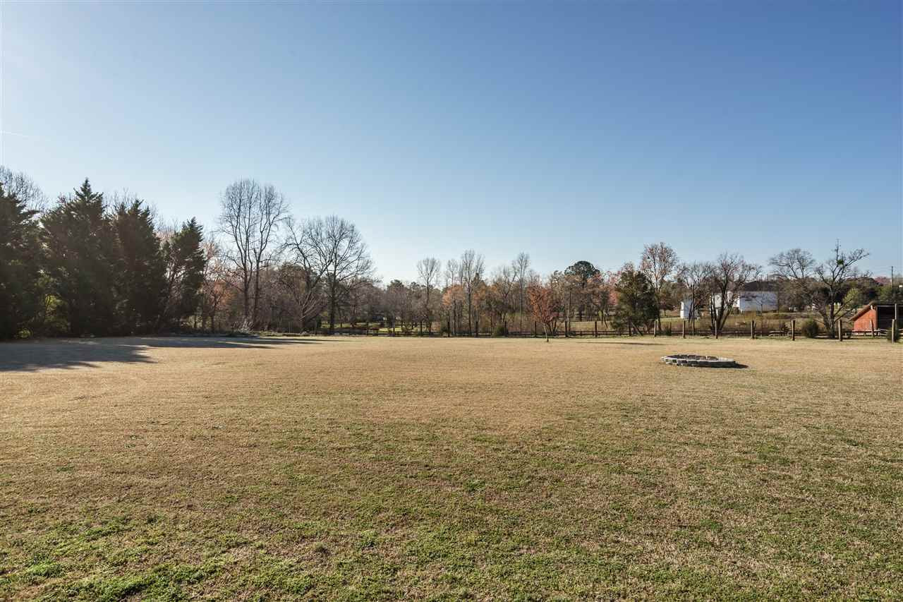904 Windrow Lane Raleigh, NC 27603 - Photo 23 of 25 Backyard and Firepit