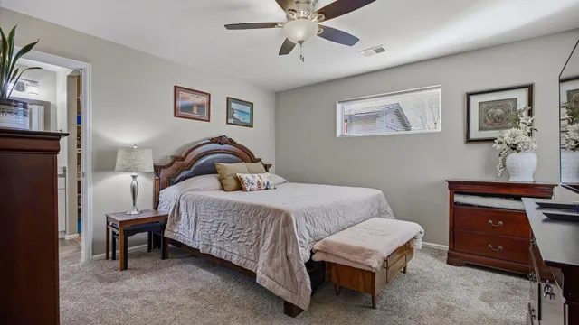 a bedroom with a bed and a dresser