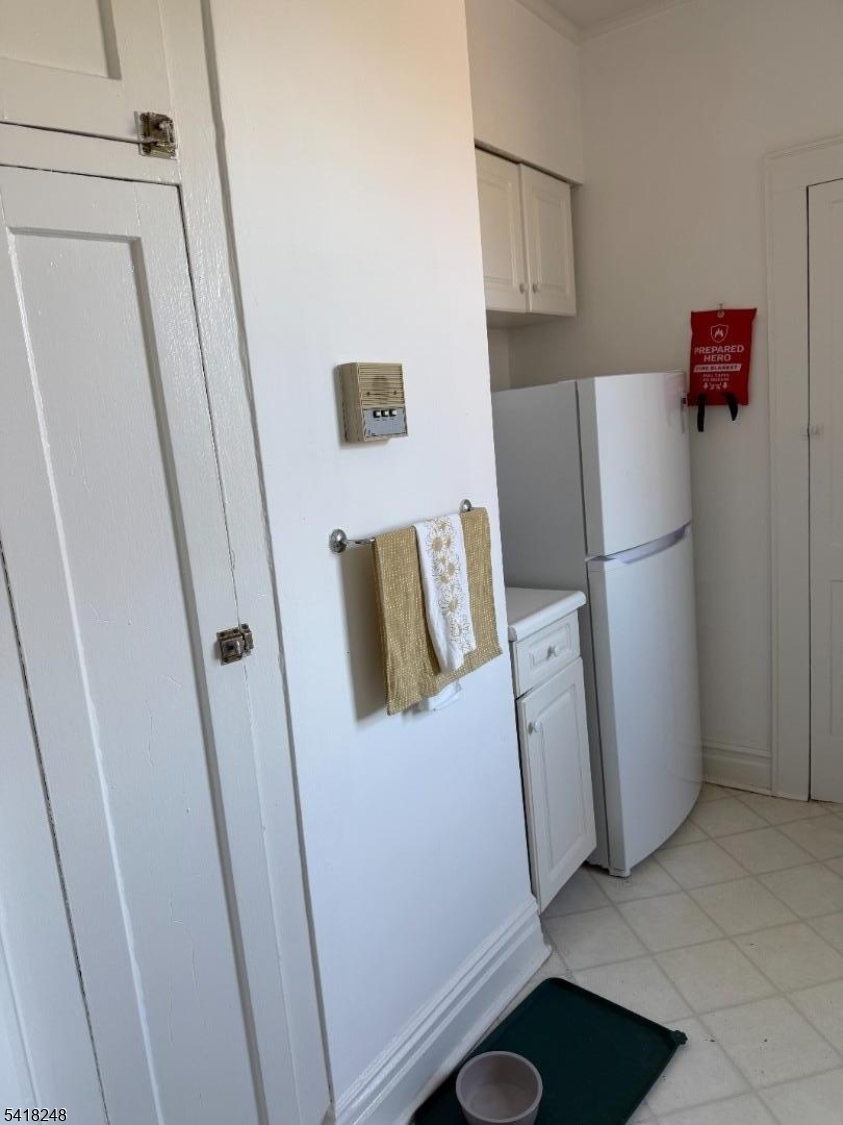 4 Riverside Drive, Unit 302 Cranford, NJ 07016 - Photo 3 of 9 a room with refrigerator and washer