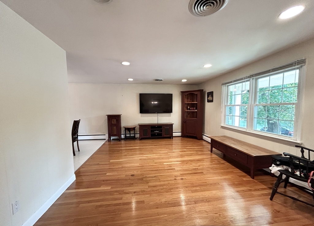 98 Sheffield Road Cranston, RI 02920 - Photo 2 of 23 a living room with furniture and a flat screen tv