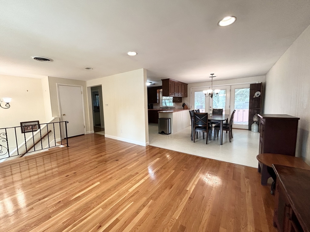 98 Sheffield Road Cranston, RI 02920 - Photo 4 of 23 a view of a dining room with furniture and wooden floor