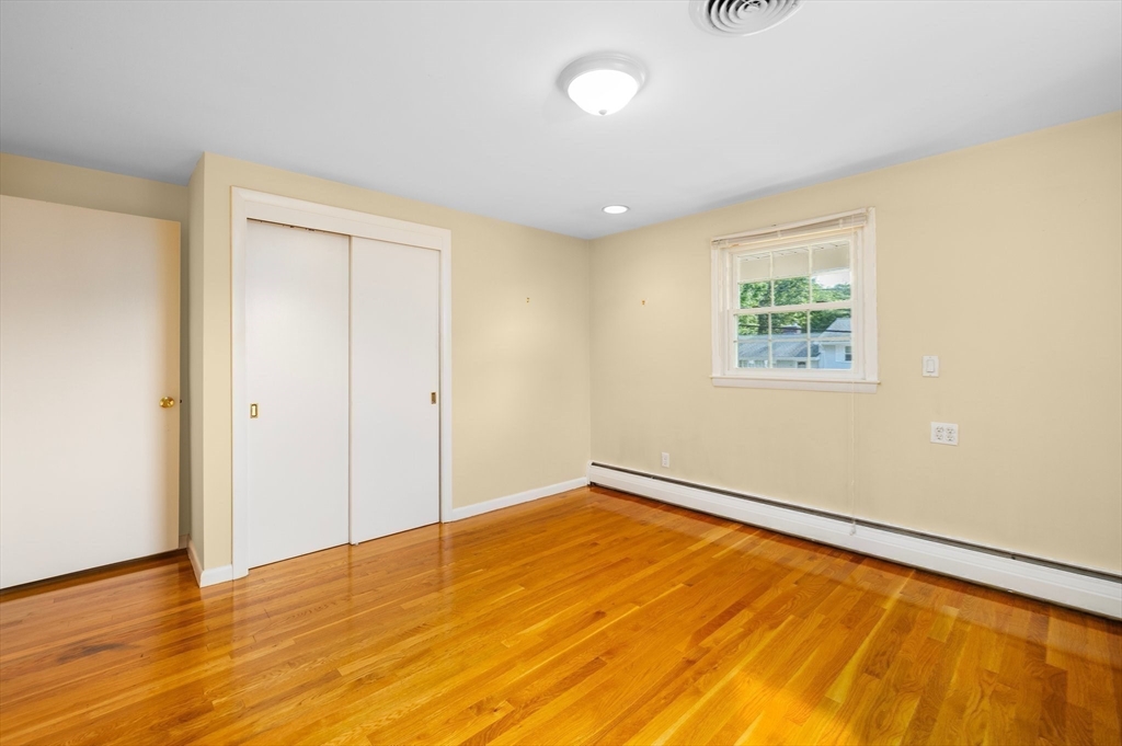 98 Sheffield Road Cranston, RI 02920 - Photo 8 of 23 a view of empty room with wooden floor