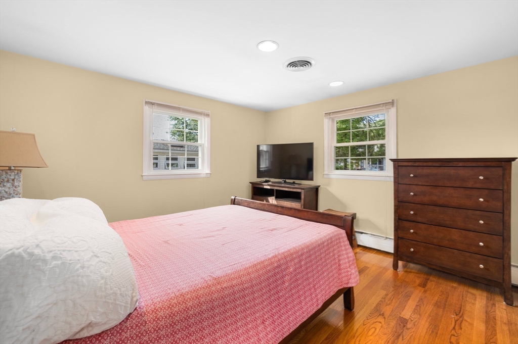 98 Sheffield Road Cranston, RI 02920 - Photo 9 of 23 a bedroom with a bed and a flat tv screen on dresser
